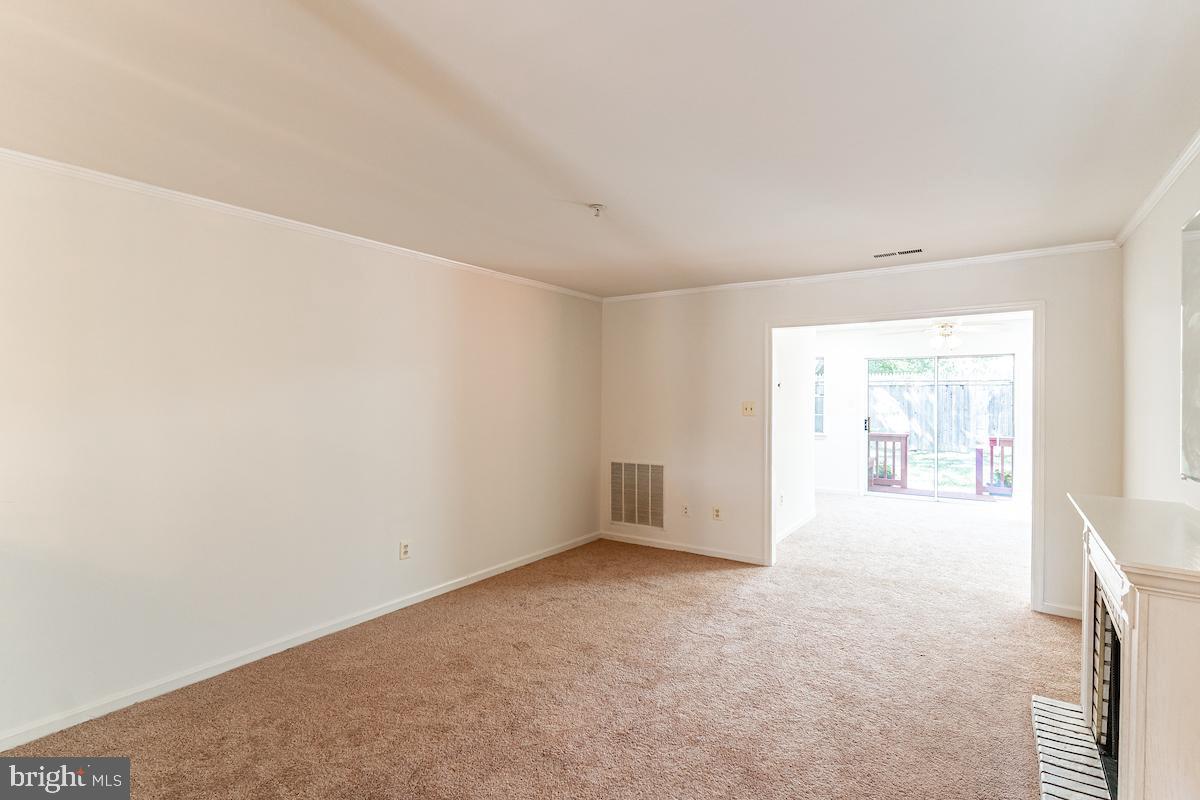 9268 Cherry Lane, Unit 57 Laurel, MD 20708 - Photo 21 of 33 Large living room with electric fireplace