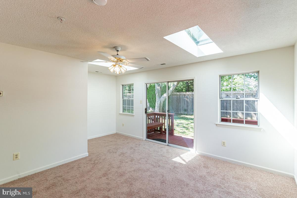 9268 Cherry Lane, Unit 57 Laurel, MD 20708 - Photo 24 of 33 Florida room leads out to large deck