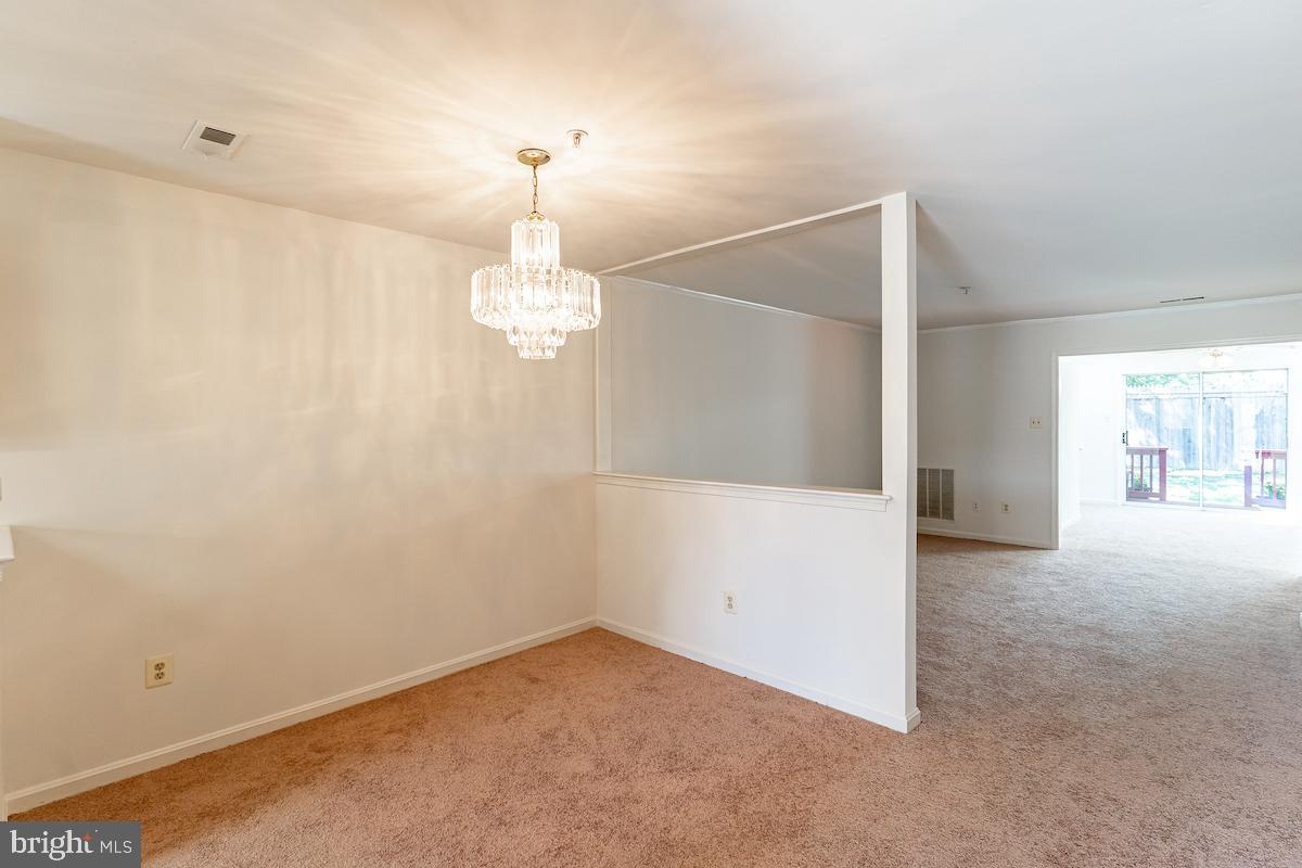 9268 Cherry Lane, Unit 57 Laurel, MD 20708 - Photo 4 of 33 Dedicated dining area and chandelier