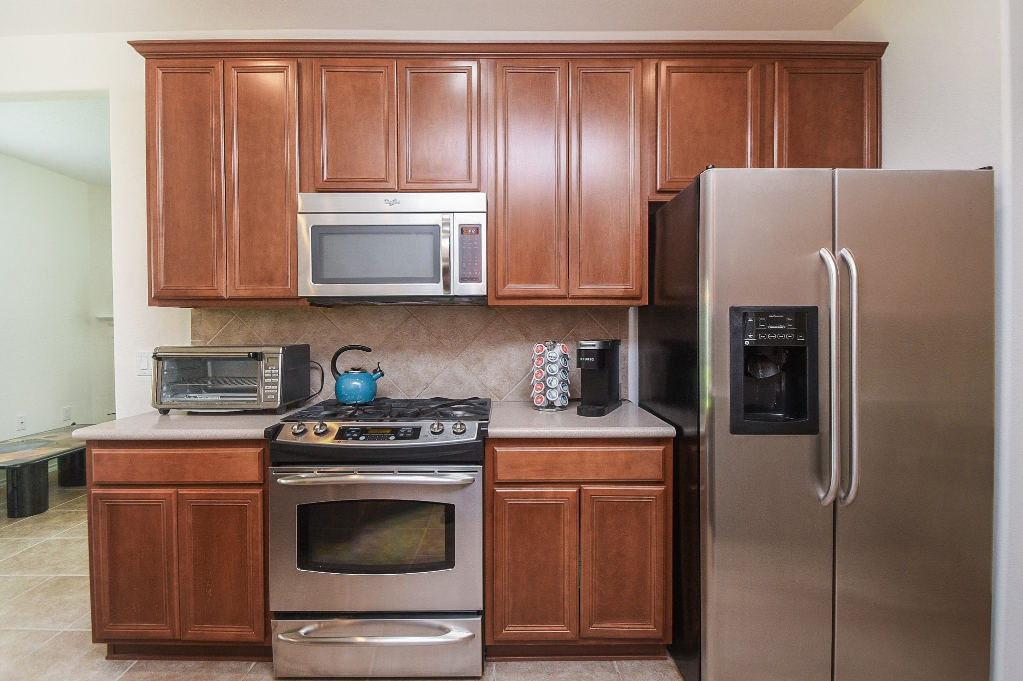 13600 Breton Ridge Street, Unit 36F Houston, TX 77070 - Photo 19 of 38 Bright kitchen offering generous storage and easy flow.