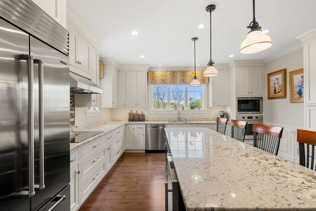 4 Point Shore Overlook Amesbury, MA 01913 - Photo 3 of 42 a kitchen with stainless steel appliances granite countertop a sink refrigerator and cabinets