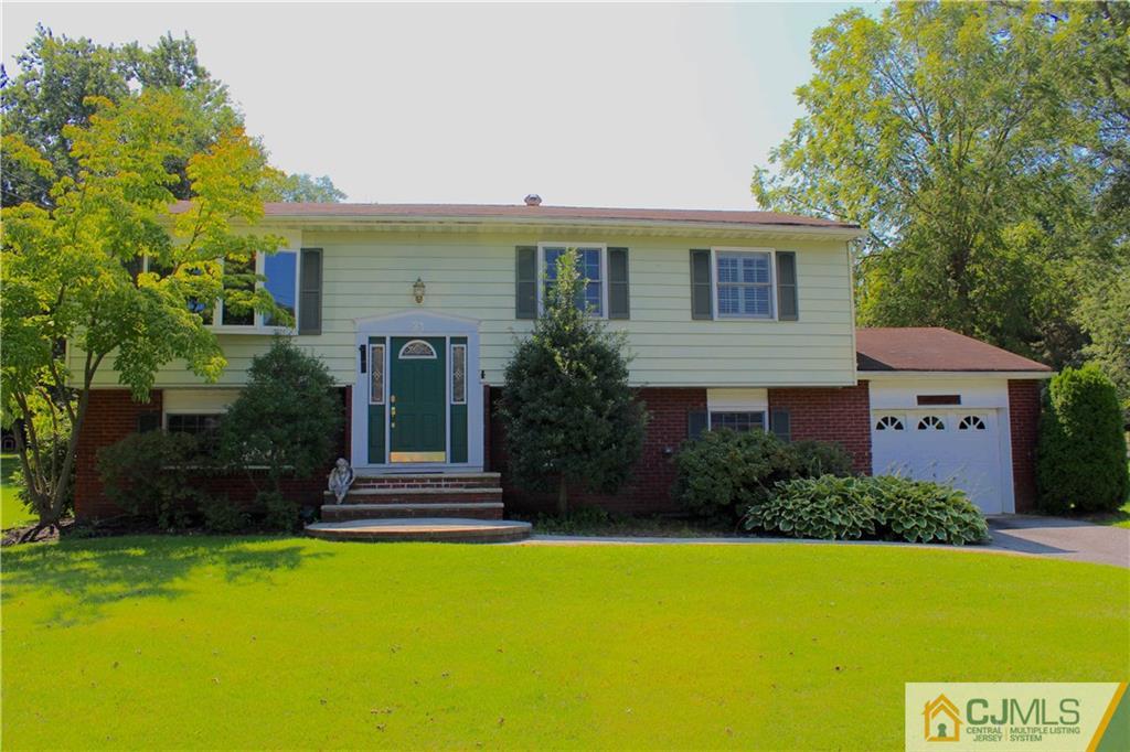 33 Andover Road Jackson, NJ 08527 - Photo 1 of 25 a front view of a house with a yard