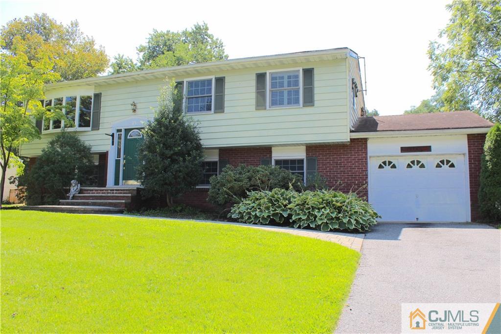 33 Andover Road Jackson, NJ 08527 - Photo 2 of 25 a front view of a house with swimming pool