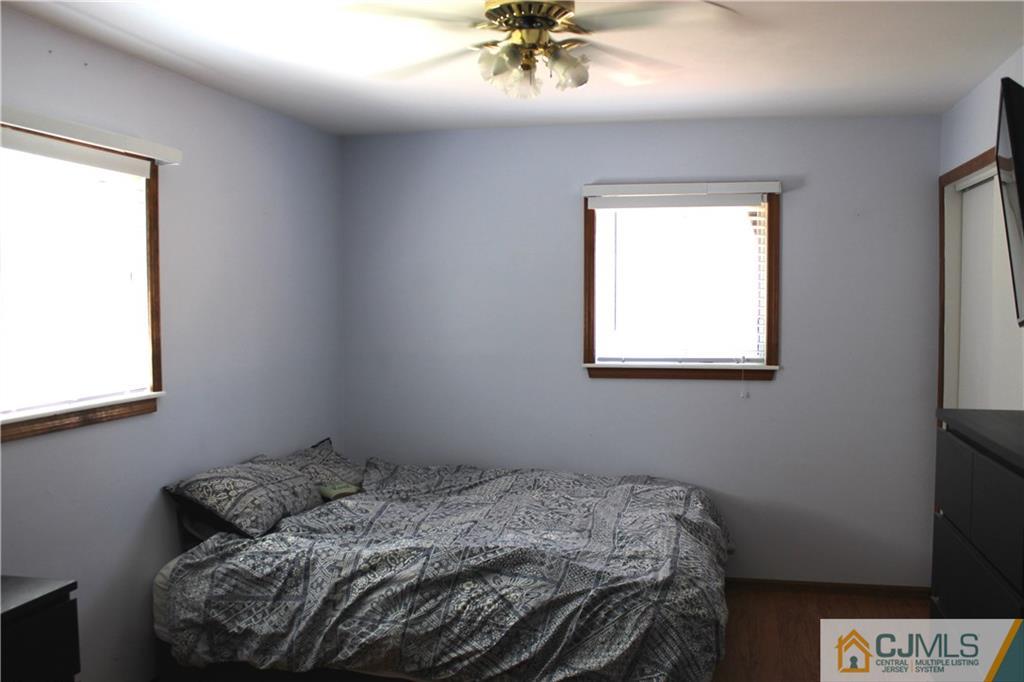 33 Andover Road Jackson, NJ 08527 - Photo 11 of 25 a bedroom with a bed and a window