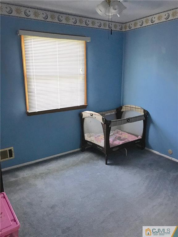 33 Andover Road Jackson, NJ 08527 - Photo 13 of 25 a room with a bed and a window