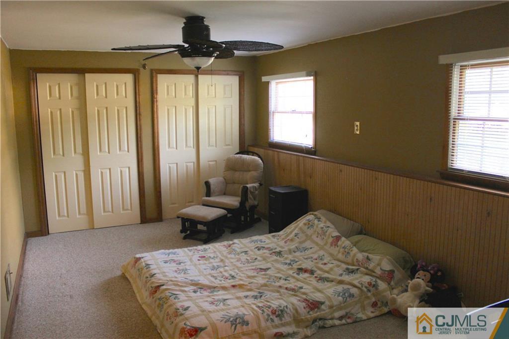 33 Andover Road Jackson, NJ 08527 - Photo 16 of 25 a bedroom with a bed and a window