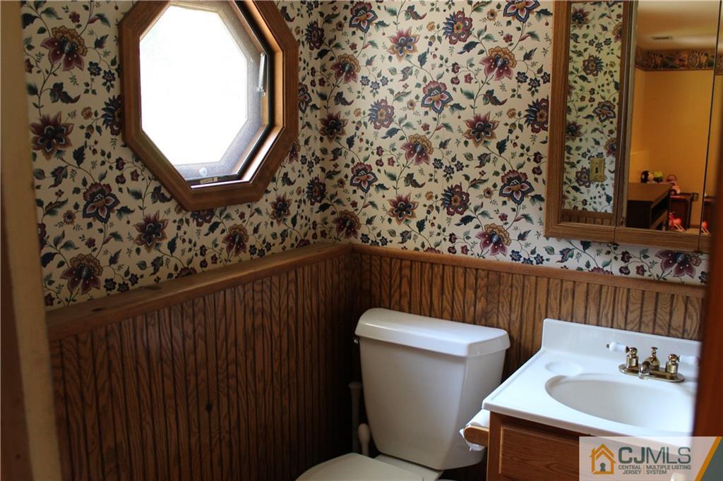 33 Andover Road Jackson, NJ 08527 - Photo 17 of 25 a bathroom with a toilet and a sink