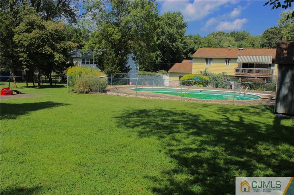 33 Andover Road Jackson, NJ 08527 - Photo 20 of 25 a front view of house with yard and trees