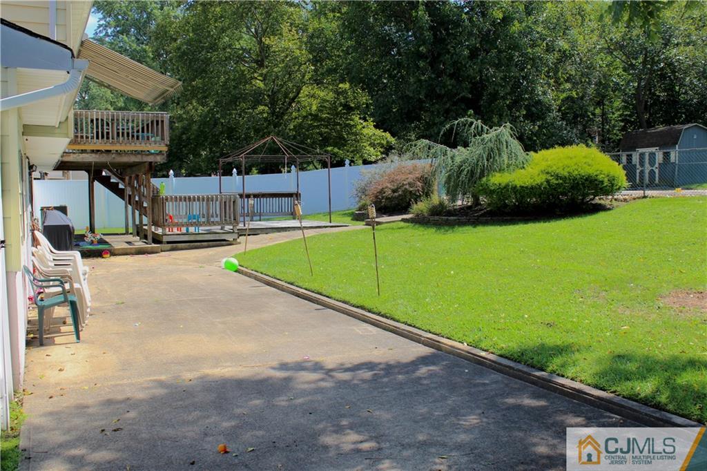 33 Andover Road Jackson, NJ 08527 - Photo 22 of 25 a view of a backyard with swimming pool
