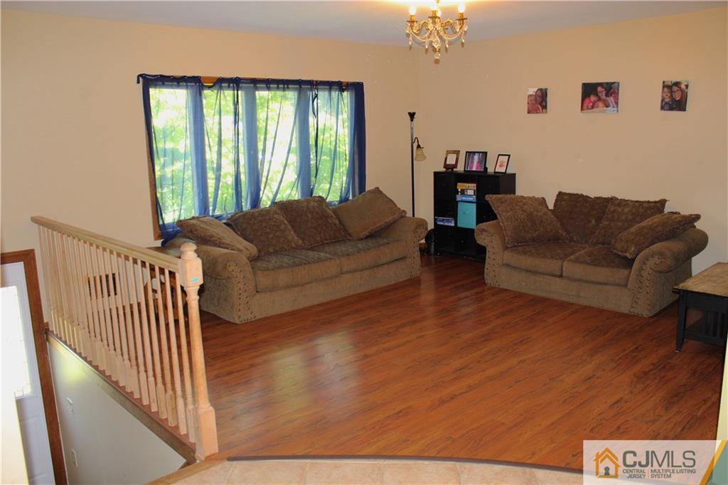 33 Andover Road Jackson, NJ 08527 - Photo 4 of 25 a living room with furniture and a large window