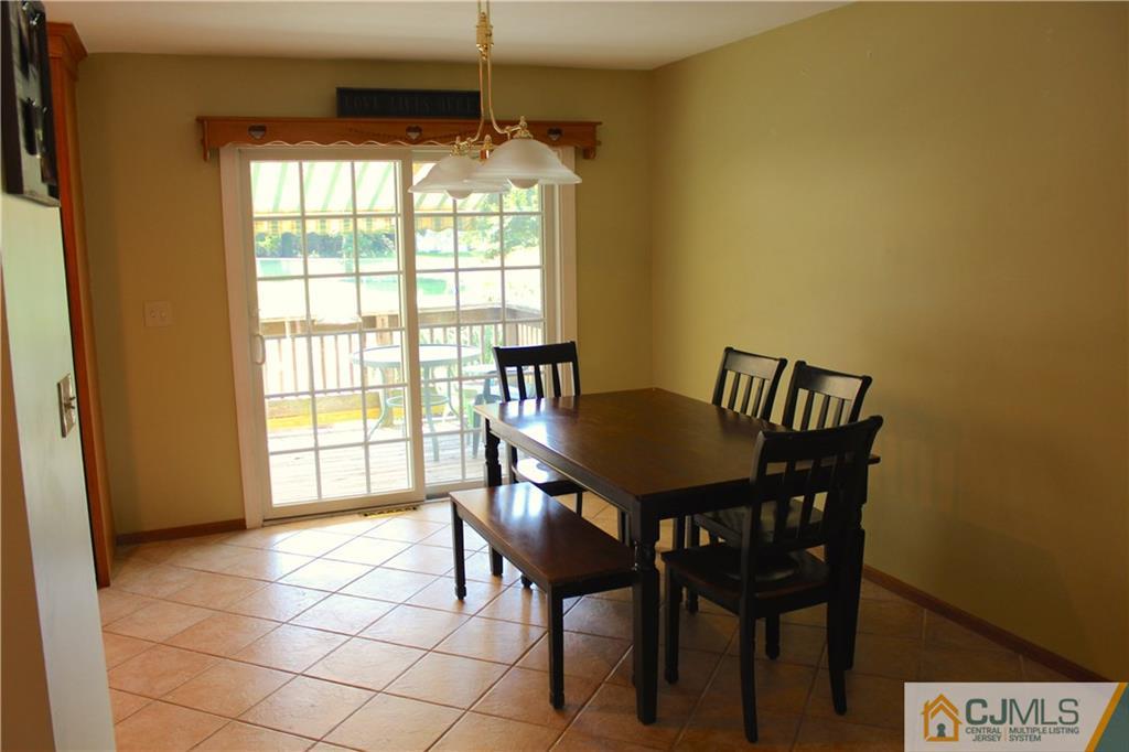 33 Andover Road Jackson, NJ 08527 - Photo 6 of 25 a view of a dining room with furniture and a window