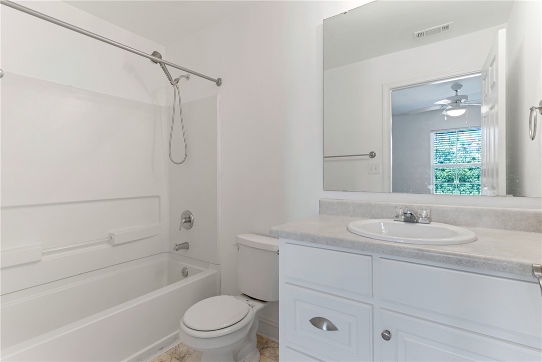 725 Lookover Drive Anderson, SC 29621 - Photo 20 of 31 White cabinetry paired with neutral countertops anchors this classic bathroom design.