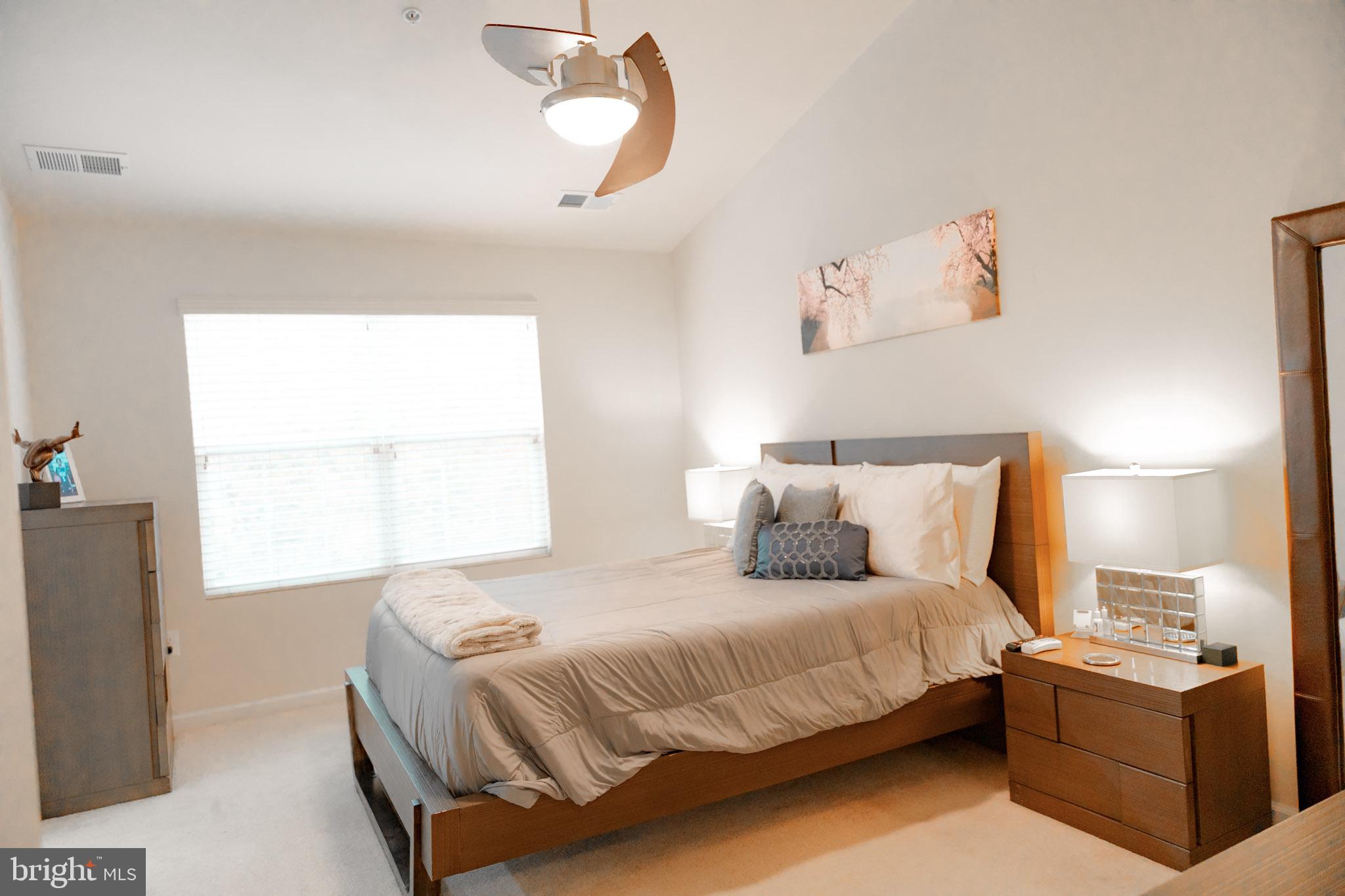 8453 Winding Trail Laurel, MD 20724 - Photo 13 of 24 a bedroom with a bed and window