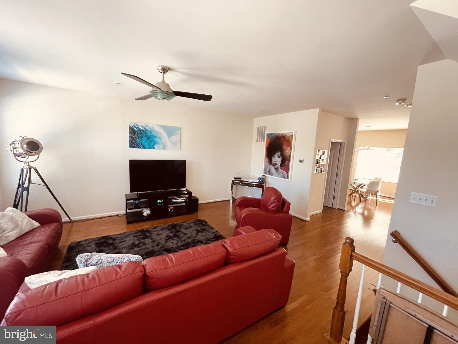 8453 Winding Trail Laurel, MD 20724 - Photo 4 of 24 a living room with furniture and a flat screen tv