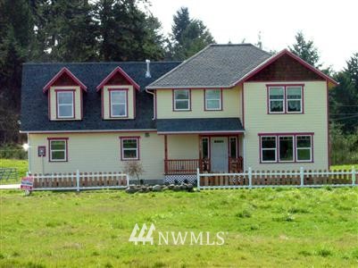 19215 Tall Firs Lane Southwest Rochester, WA 98579 - Photo 1 of 1 a front view of a house with garden