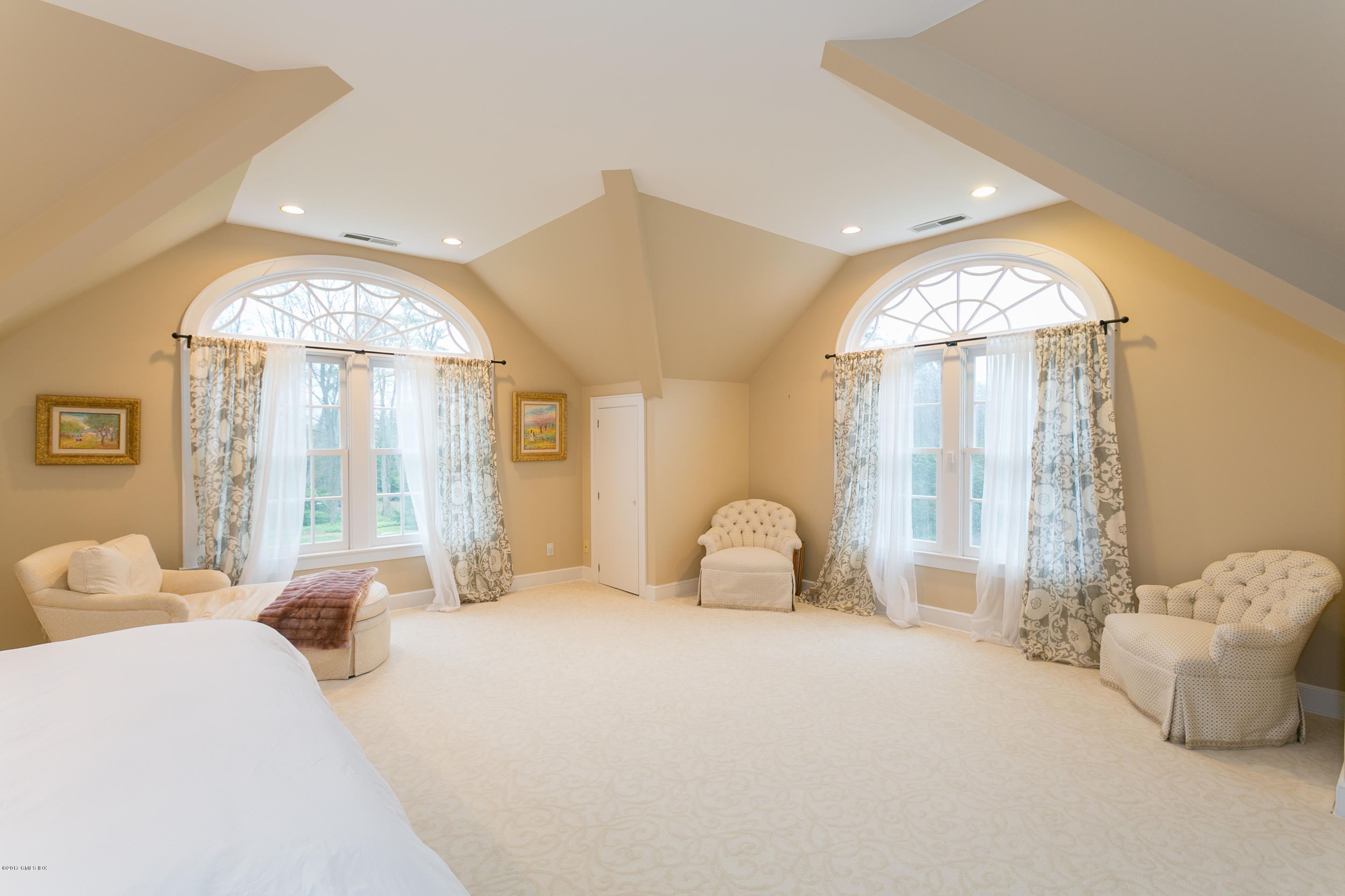 20 Dewart Road Greenwich, CT 06830 - Photo 16 of 22 a bedroom with a large bed and a large window