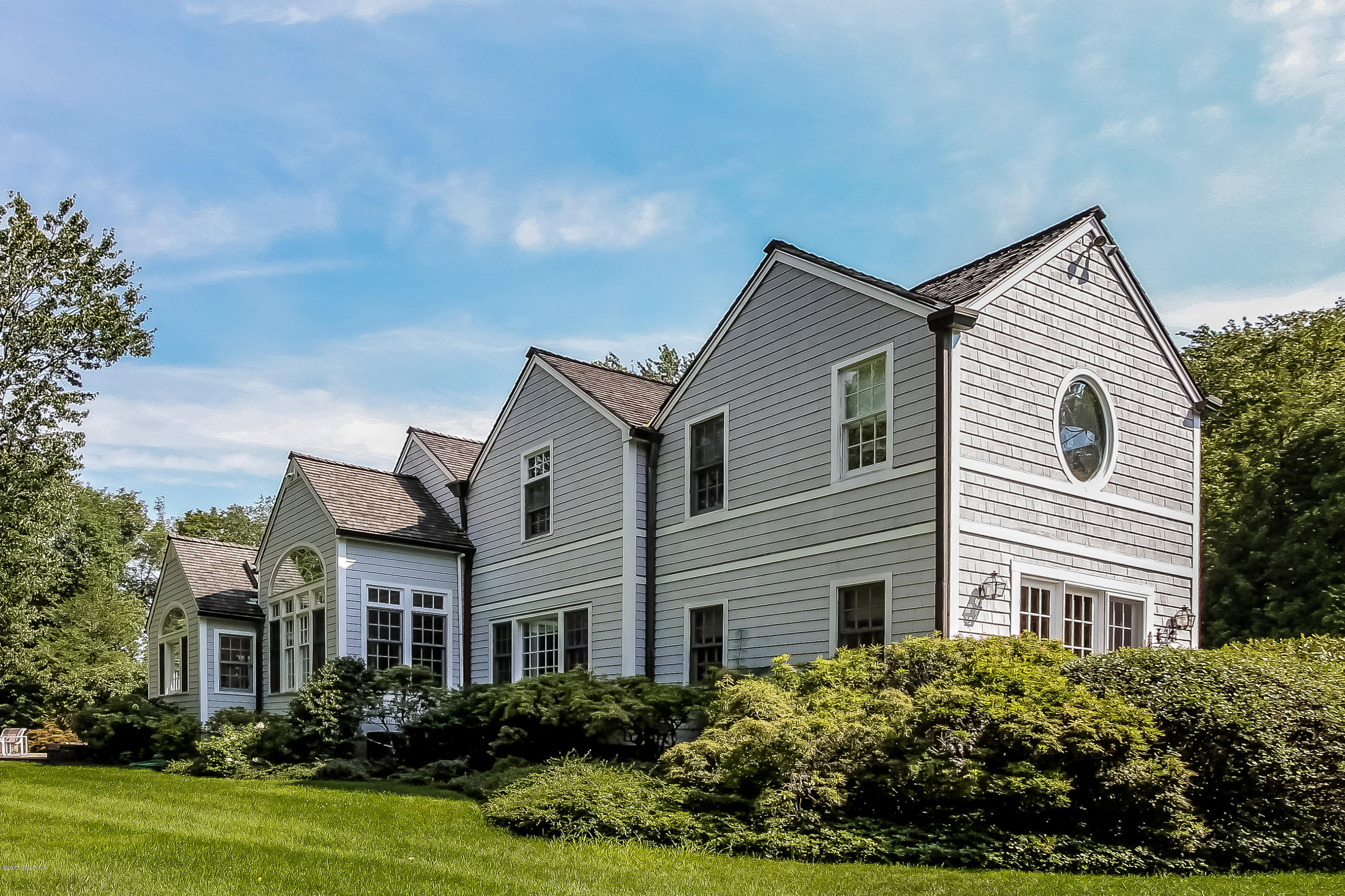 20 Dewart Road Greenwich, CT 06830 - Photo 22 of 22 a front view of a house with garden