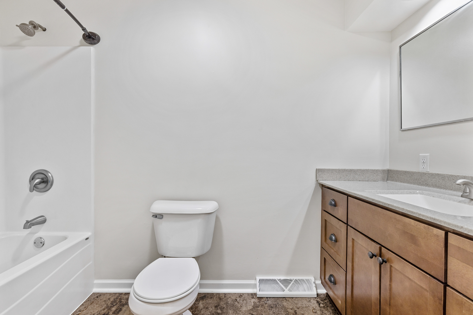 1413 Brookside Drive Rochelle, IL 61068 - Photo 15 of 29 a bathroom with a granite countertop toilet a sink and bathtub