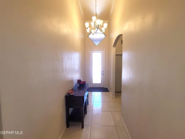 a spacious en suite bathroom with a toilet sink and mirror