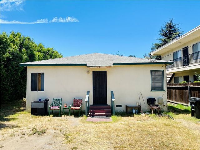 a view of a house with snow in the yard