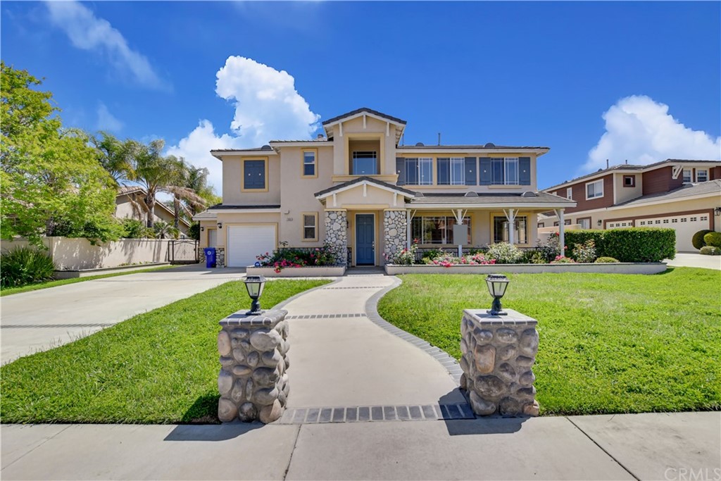 13631 Jeremy Court Rancho Cucamonga, CA 91739 - Photo 1 of 1 a front view of a house with a yard