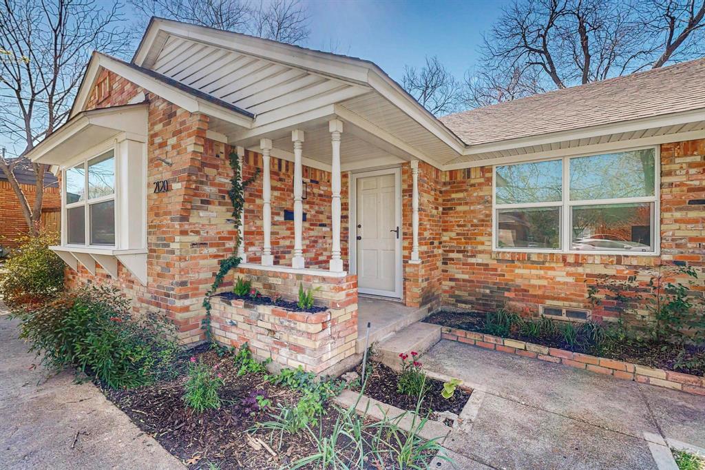 2120 Healey Drive Dallas, TX 75228 - Photo 2 of 39 a front view of a house with garden