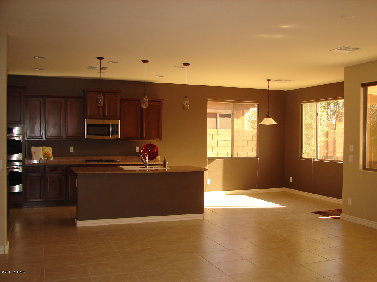 17563 West Verdin Road Goodyear, AZ 85338 - Photo 22 of 40 HUGE kitchen open to living room