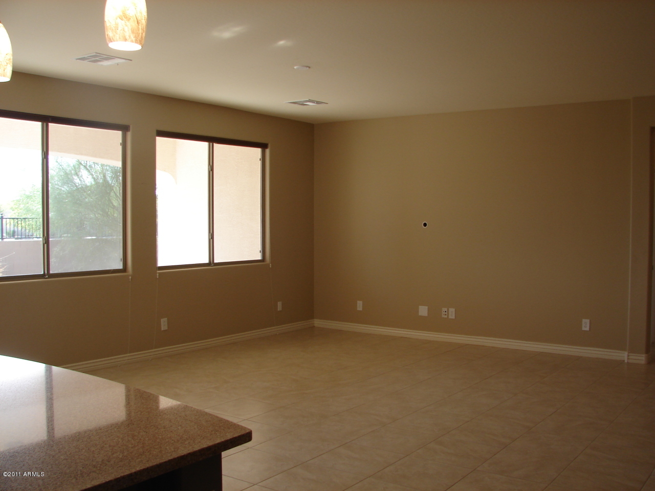 17563 West Verdin Road Goodyear, AZ 85338 - Photo 27 of 40 Large living room open to kitchen