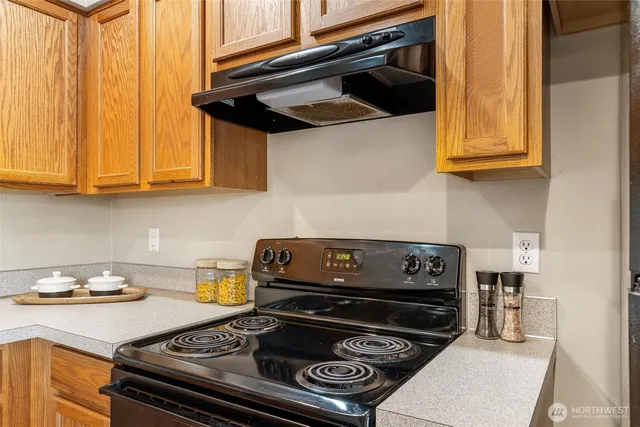 a kitchen with a stove and a microwave
