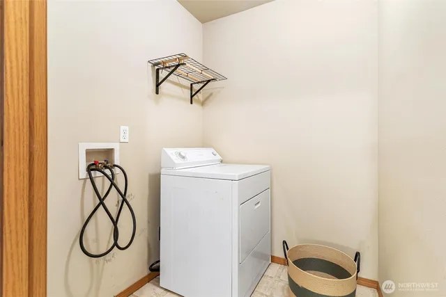 a bedroom with a bed and lamp