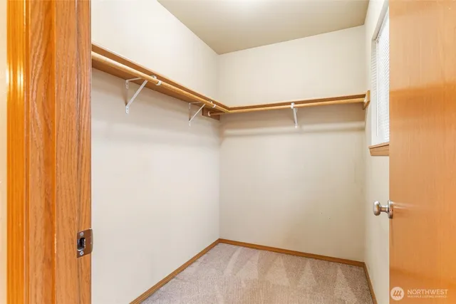 a bathroom with a toilet a sink and a mirror