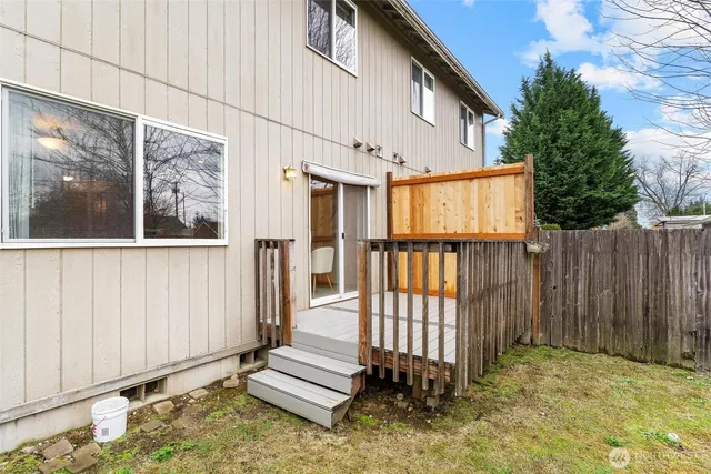 a view of a backyard with tree