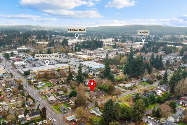 an aerial view of a house with a yard