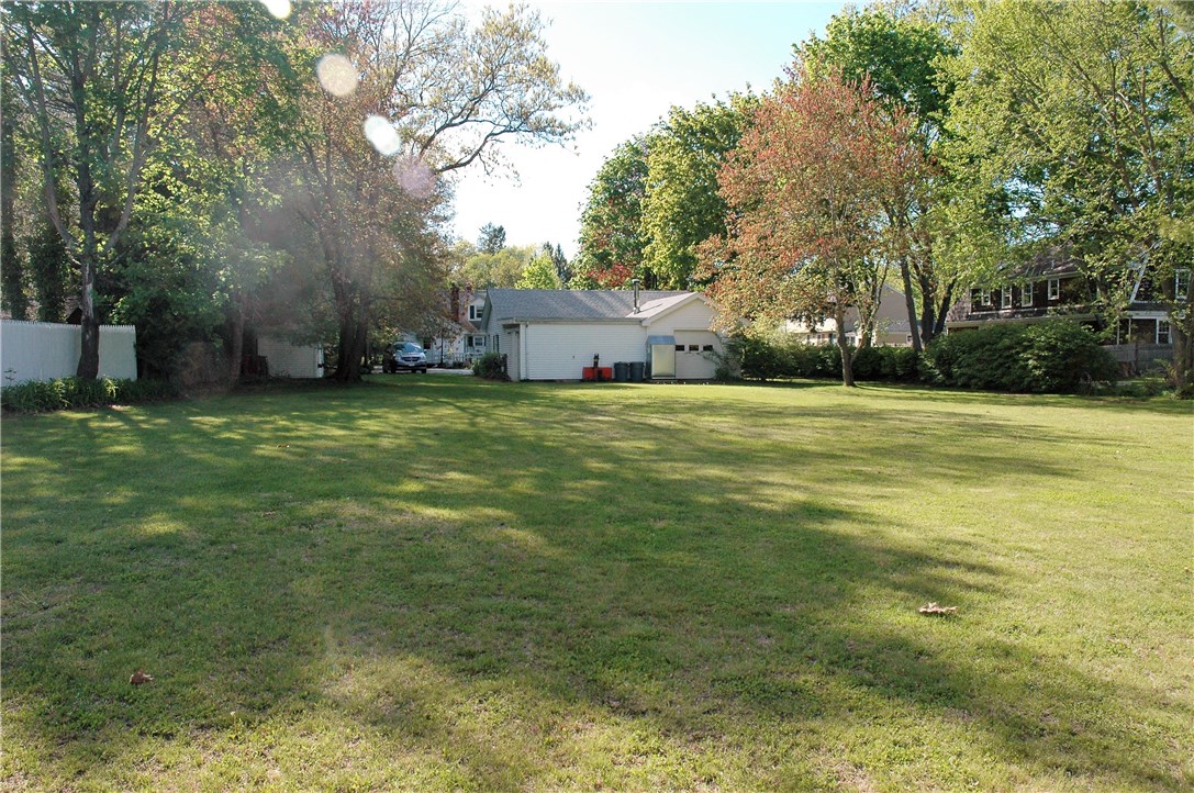 401 New Meadow Road Barrington, RI 02806 - Photo 8 of 11 Large rear yard facing back toward garage and house.