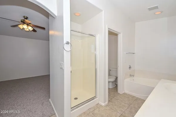 a bathroom with a tub and shower