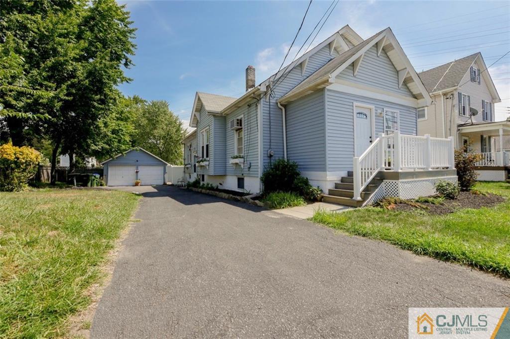 65 Meadow Road Edison, NJ 08817 - Photo 1 of 24 a front view of house with yard and green space