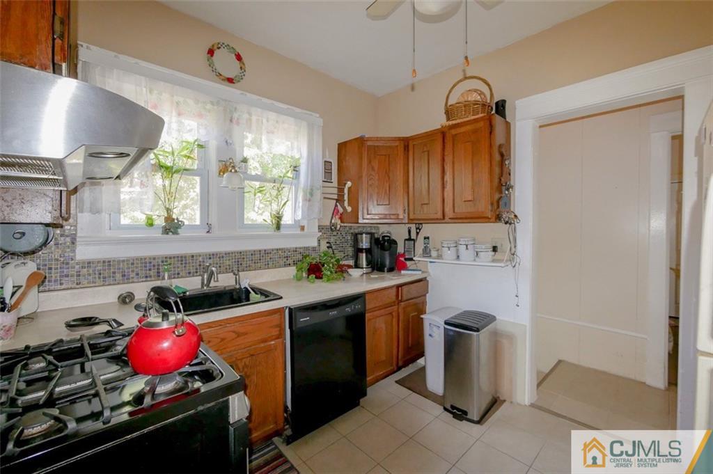 65 Meadow Road Edison, NJ 08817 - Photo 12 of 24 a kitchen with a sink cabinets and window