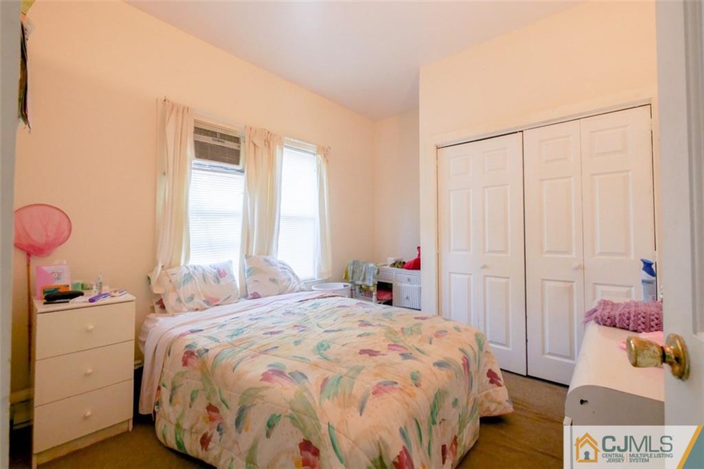65 Meadow Road Edison, NJ 08817 - Photo 15 of 24 a bedroom with a bed and a window