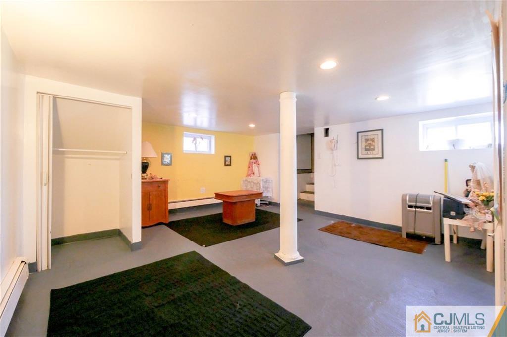 65 Meadow Road Edison, NJ 08817 - Photo 23 of 24 a spacious bedroom with a bed and furniture