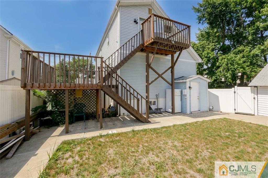 65 Meadow Road Edison, NJ 08817 - Photo 4 of 24 a view of a house with backyard and deck