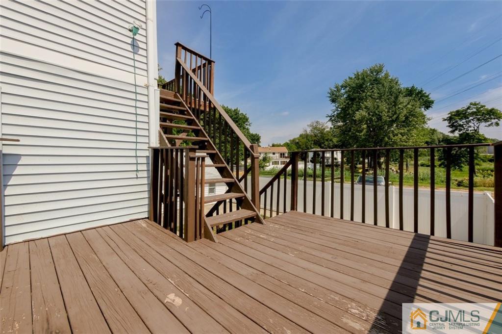 65 Meadow Road Edison, NJ 08817 - Photo 5 of 24 a view of a wooden deck