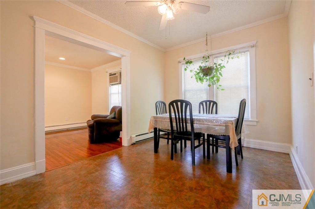 65 Meadow Road Edison, NJ 08817 - Photo 10 of 24 a view of a dining room with furniture window and wooden floor