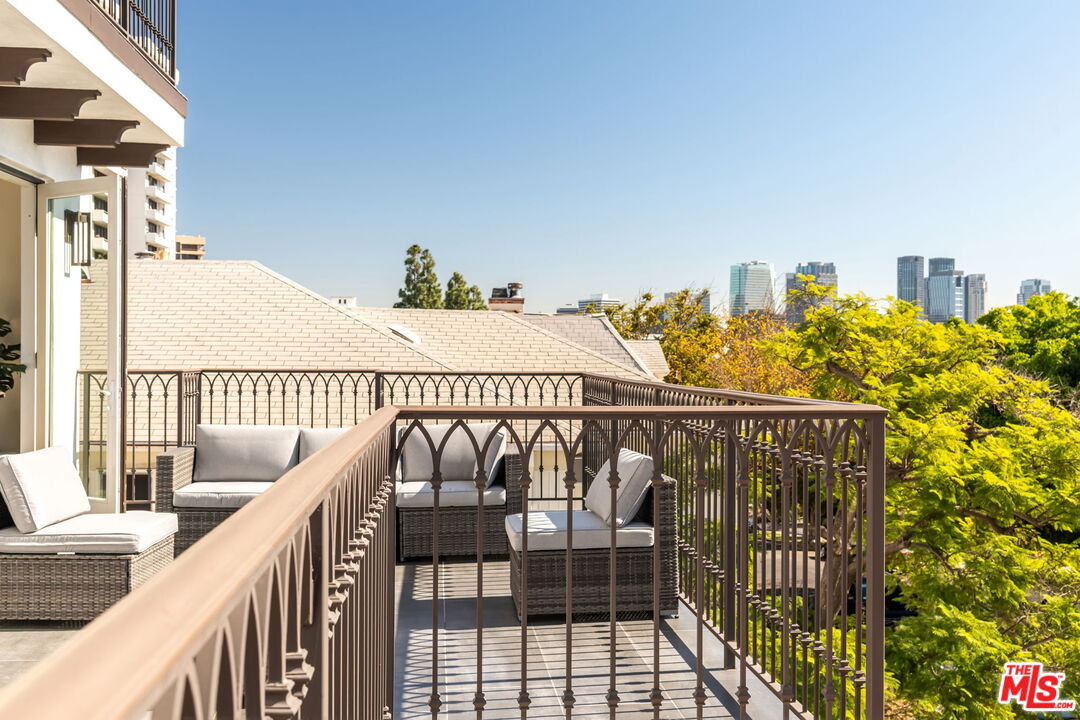 10725 Ashton Avenue, Unit 101 Los Angeles, CA 90024 - Photo 20 of 40 a view of balcony with furniture