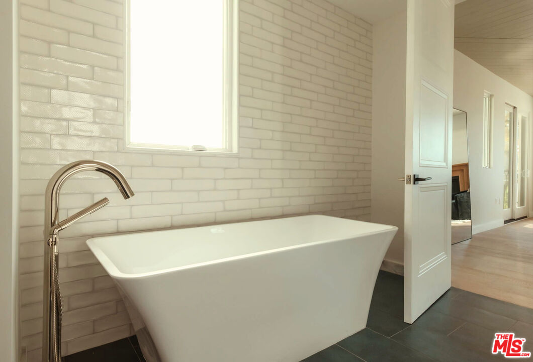 10725 Ashton Avenue, Unit 101 Los Angeles, CA 90024 - Photo 29 of 40 a bathroom with a sink