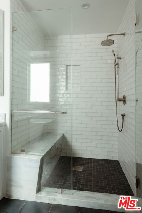 10725 Ashton Avenue, Unit 101 Los Angeles, CA 90024 - Photo 30 of 40 a bathroom with a shower