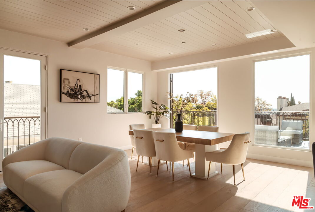 10725 Ashton Avenue, Unit 101 Los Angeles, CA 90024 - Photo 7 of 40 a living room with furniture and a large window