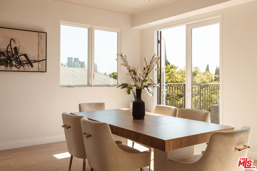 10725 Ashton Avenue, Unit 101 Los Angeles, CA 90024 - Photo 8 of 40 a view of a dining room with furniture and window