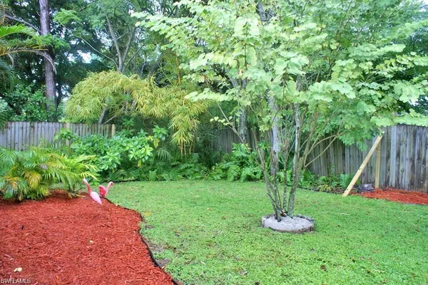 a view of a backyard with a fountain