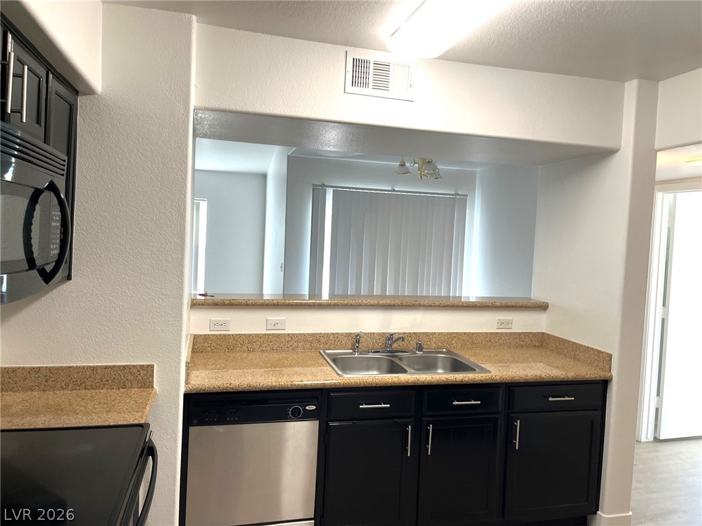 A convenient pass-through window connects the kitchen workspace to the adjacent dining area.