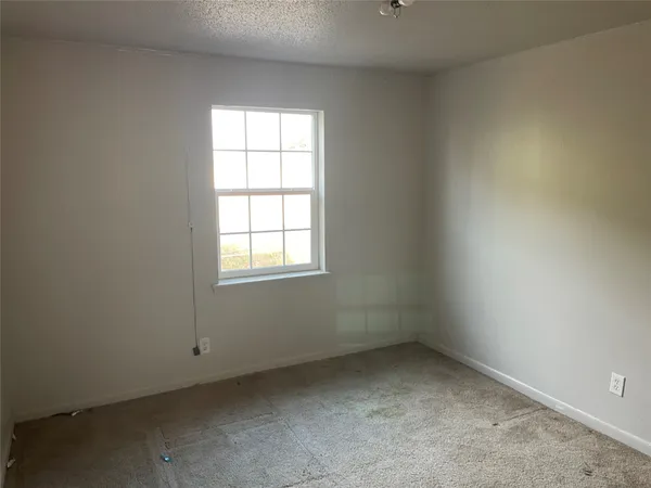 a bathroom with a sink a toilet a tub and shower
